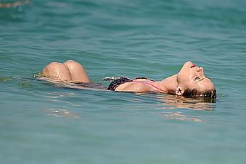 Michelle Hunziker in bikini at a beach