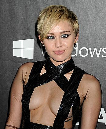 Miley Cyrus posing almost topless at amfAR LA Inspiration Gala in Hollywood