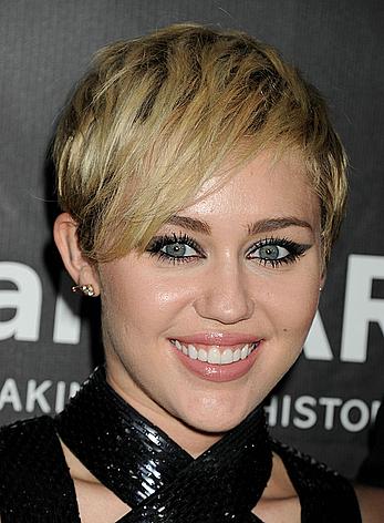 Miley Cyrus posing almost topless at amfAR LA Inspiration Gala in Hollywood