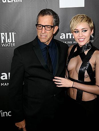 Miley Cyrus posing almost topless at amfAR LA Inspiration Gala in Hollywood