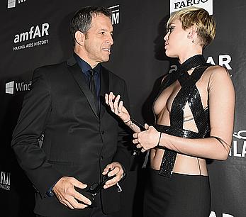 Miley Cyrus posing almost topless at amfAR LA Inspiration Gala in Hollywood