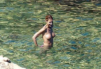 Monica Pont topless on a beach paparazzi shots