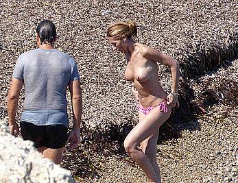 Monica Pont topless on a beach paparazzi shots