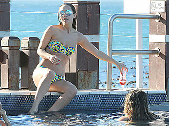 Myleene Klass seen on holiday by the pool in a bikini