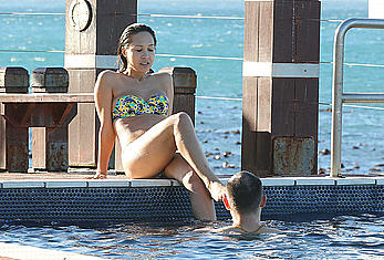 Myleene Klass seen on holiday by the pool in a bikini