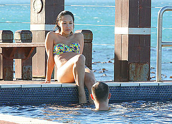 Myleene Klass seen on holiday by the pool in a bikini