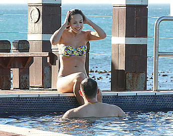 Myleene Klass seen on holiday by the pool in a bikini