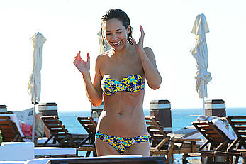 Myleene Klass seen on holiday by the pool in a bikini