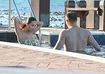 Myleene Klass seen on holiday by the pool in a bikini