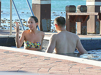 Myleene Klass seen on holiday by the pool in a bikini