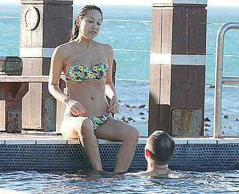 Myleene Klass seen on holiday by the pool in a bikini