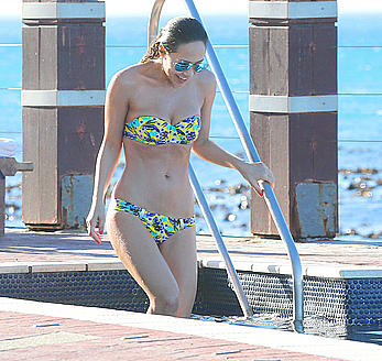 Myleene Klass seen on holiday by the pool in a bikini