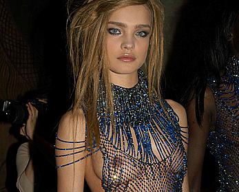 Natalia Vodianova topless under fishnet dress