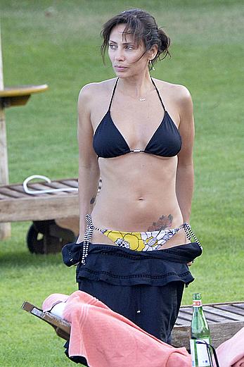 Natalie Imbruglia nipslip wearing a bikini in Sardinia