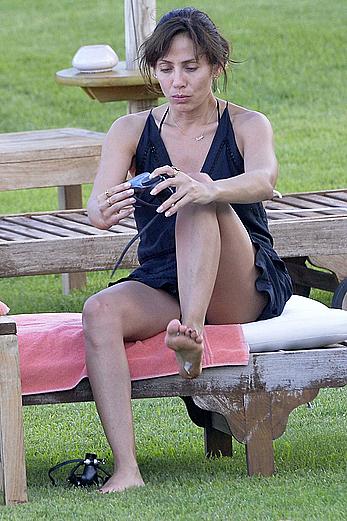 Natalie Imbruglia nipslip wearing a bikini in Sardinia