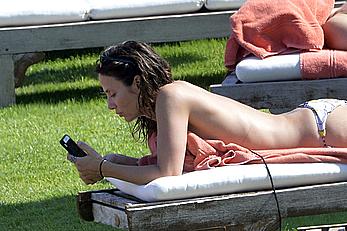 Natalie Imbruglia nipslip wearing a bikini in Sardinia