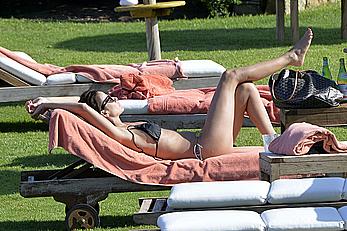 Natalie Imbruglia nipslip wearing a bikini in Sardinia