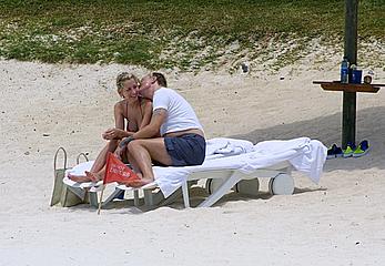 Natalie Appleton sunbathing topless on a beach