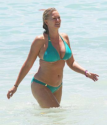 Natasha Henstridge in blue bikini at a beach in Hawaii