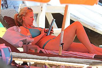 Natasha Henstridge in blue bikini at a beach in Hawaii