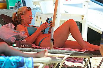 Natasha Henstridge in blue bikini at a beach in Hawaii