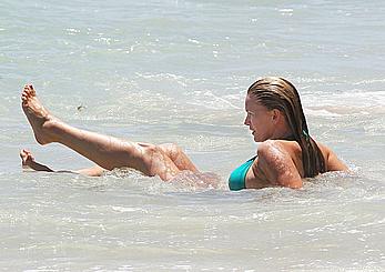 Natasha Henstridge in blue bikini at a beach in Hawaii