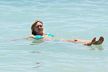 Natasha Henstridge in blue bikini at a beach in Hawaii