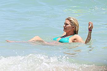 Natasha Henstridge in blue bikini at a beach in Hawaii