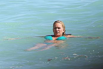 Natasha Henstridge in blue bikini at a beach in Hawaii