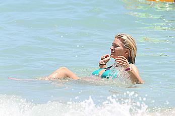 Natasha Henstridge in blue bikini at a beach in Hawaii