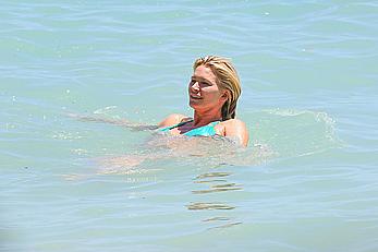 Natasha Henstridge in blue bikini at a beach in Hawaii