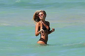 Natasha Oakley black bikini on a beach in Miami