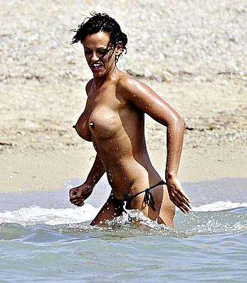 Nereida Gallardo sunbathing topless on a beach