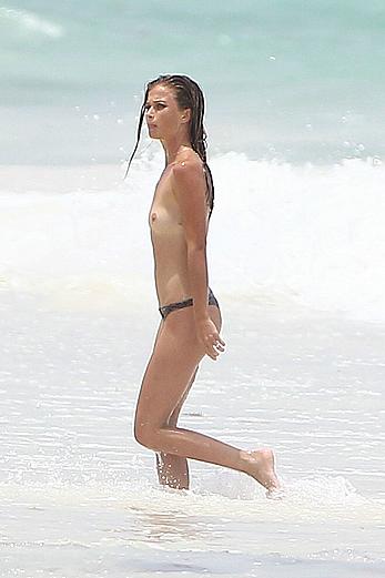 Niamh Adkins topless on a on a beach in Tulum