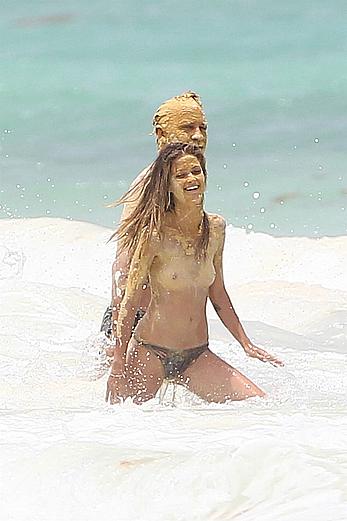 Niamh Adkins topless on a on a beach in Tulum