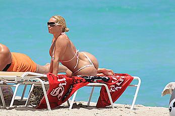 Nicole Coco Austin in a thong bikini shows areola slip in Miami Beach