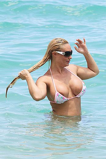 Nicole Coco Austin in a thong bikini shows areola slip in Miami Beach