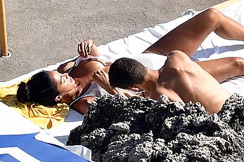 Nicole Scherzinger boobs out while sunbathing with boyfriend in Capri