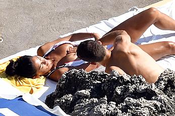 Nicole Scherzinger boobs out while sunbathing with boyfriend in Capri