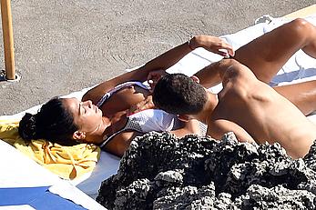 Nicole Scherzinger boobs out while sunbathing with boyfriend in Capri