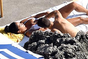 Nicole Scherzinger boobs out while sunbathing with boyfriend in Capri