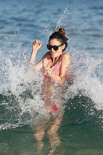 Nicole Trunfio cleavage and hard nipps in a pink bikini at Bondi Beach in Sydney