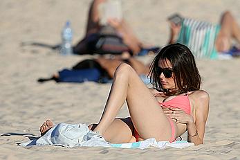 Nicole Trunfio cleavage and hard nipps in a pink bikini at Bondi Beach in Sydney