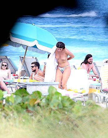 Nima Benati topless on the beach in Miami