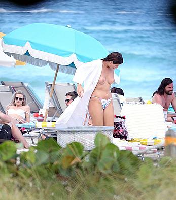 Nima Benati topless on the beach in Miami