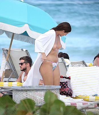 Nima Benati topless on the beach in Miami