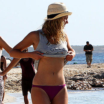 Nora Arnezeder topless on a beach in Spain