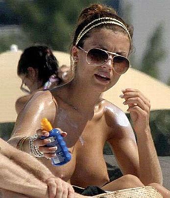 Oksana Andersson topless on a beach paparazzi photos