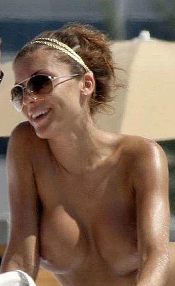 Oksana Andersson topless on a beach paparazzi photos