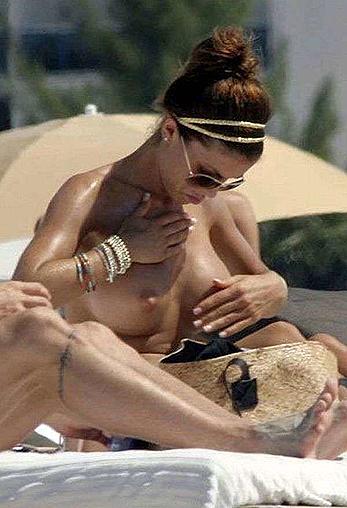 Oksana Andersson topless on a beach paparazzi photos